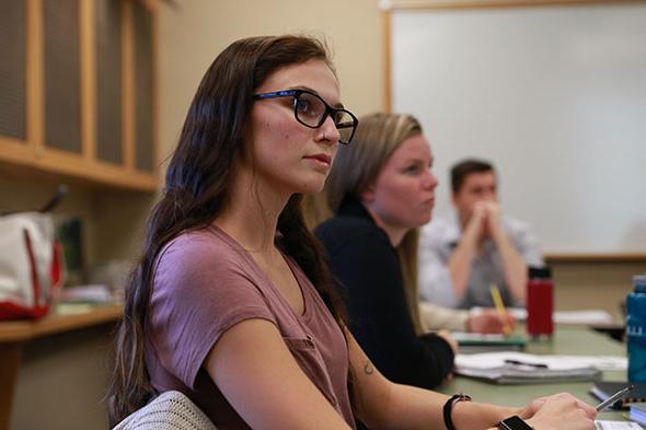 Students focus in a Clinical Psychology class at Saint Michael's College.
