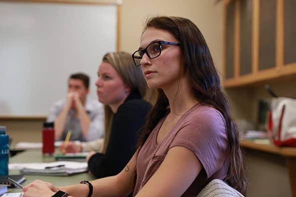 Students focus in a Clinical Psychology class at Saint Michael's College.