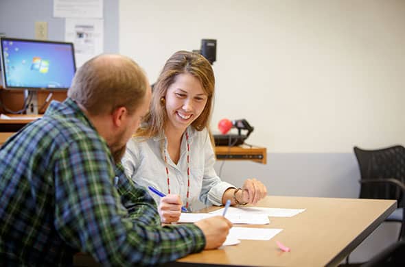 Students work on a project in a Graduate Education course at Saint Michael's College. 