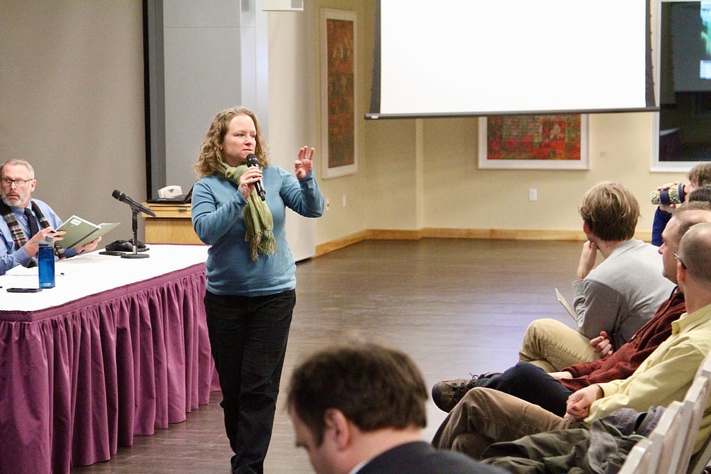 Patti Delaney of the College's anthropology faculty makes a point during Thursday's discussion in the Roy Room