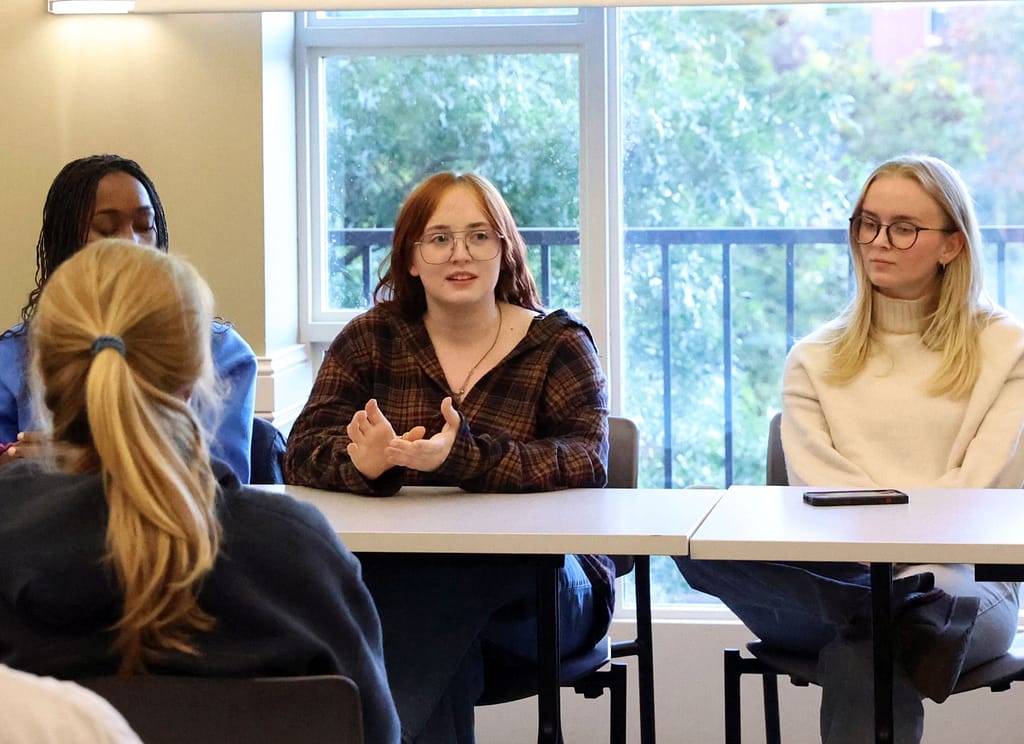 Delaney Progen '25, center, discusses her experience as an intern abroad through an internship program funded by the Freeman Foundation during a panel in October 2024. (Photo by Niyo Vainqueur '28)