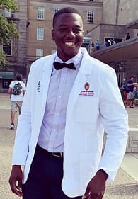 Saint Michael's College graduate Mohamed Fofana poses outside the University of Wisconsin Medical School, which he attends. 