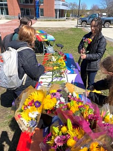 The Random Acts of Kindness Club puts on an event for students to create flower bouquets.