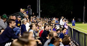 Fans watch a game at Duffy Field at Saint Michael's College
