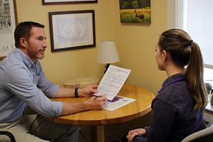 A Career Coach from the Career Education Center meets with a student in an office on the campus of Saint Michael's College. 