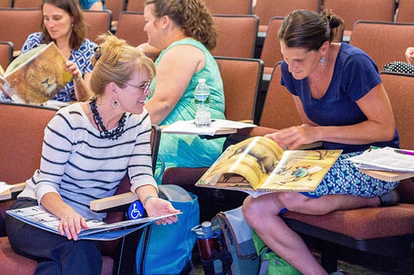 Students and professors have a discussion during a class at Saint Michael's College.