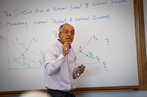 Professor Reza Ramanzani teaches a class during Accelerated Summer College at Saint Michael's. 