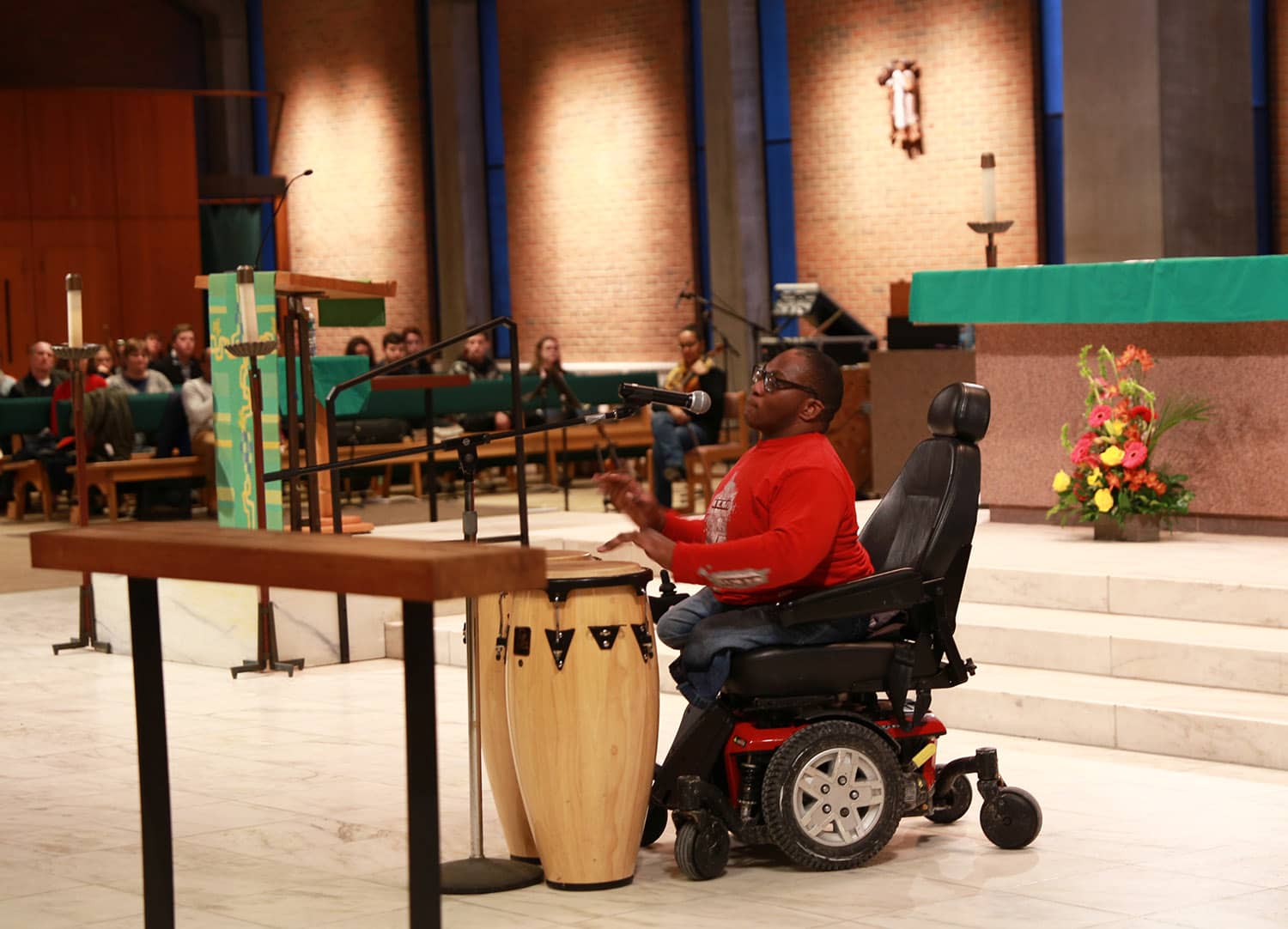 Student Daneroy Lawrence performs a musical piece at Monday's chapel event.
