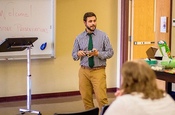 A student presents his project during a Masters in Education class at Saint Michael's College. 