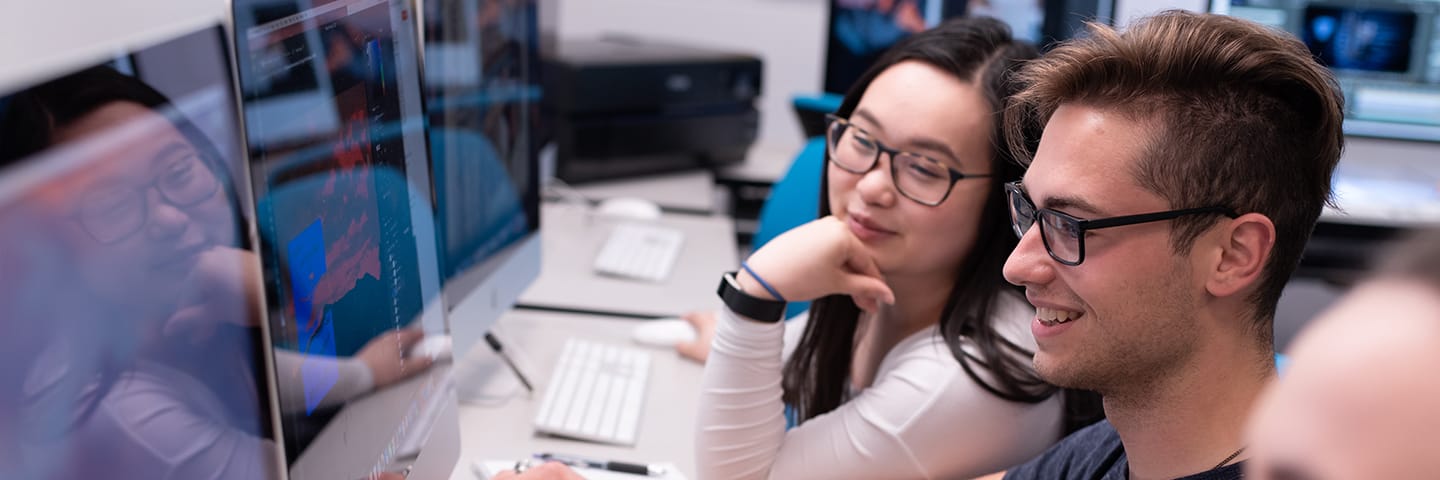 Students at Saint Michael's College work on a project in the Mac Lab. 