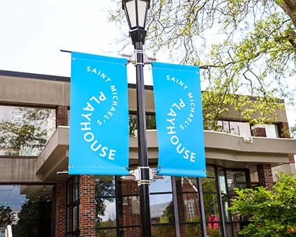 Colorful banners outside the McCarthy Arts Center proclaim the opening of the Playhouse season.