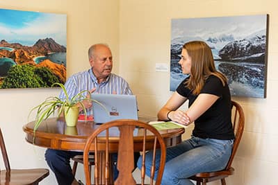 Lou DiMasi, student success advisor with a student in the comfortable Purposeful Learning office in Joyce Hall. 