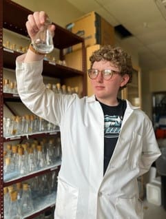 Windsor High School senior Ernest Hodgdons of Windsor, Vermont, holds a beaker during his summer 2023 internship at Saint Michael's College. (Photos courtesy Ernest Hodgdons)