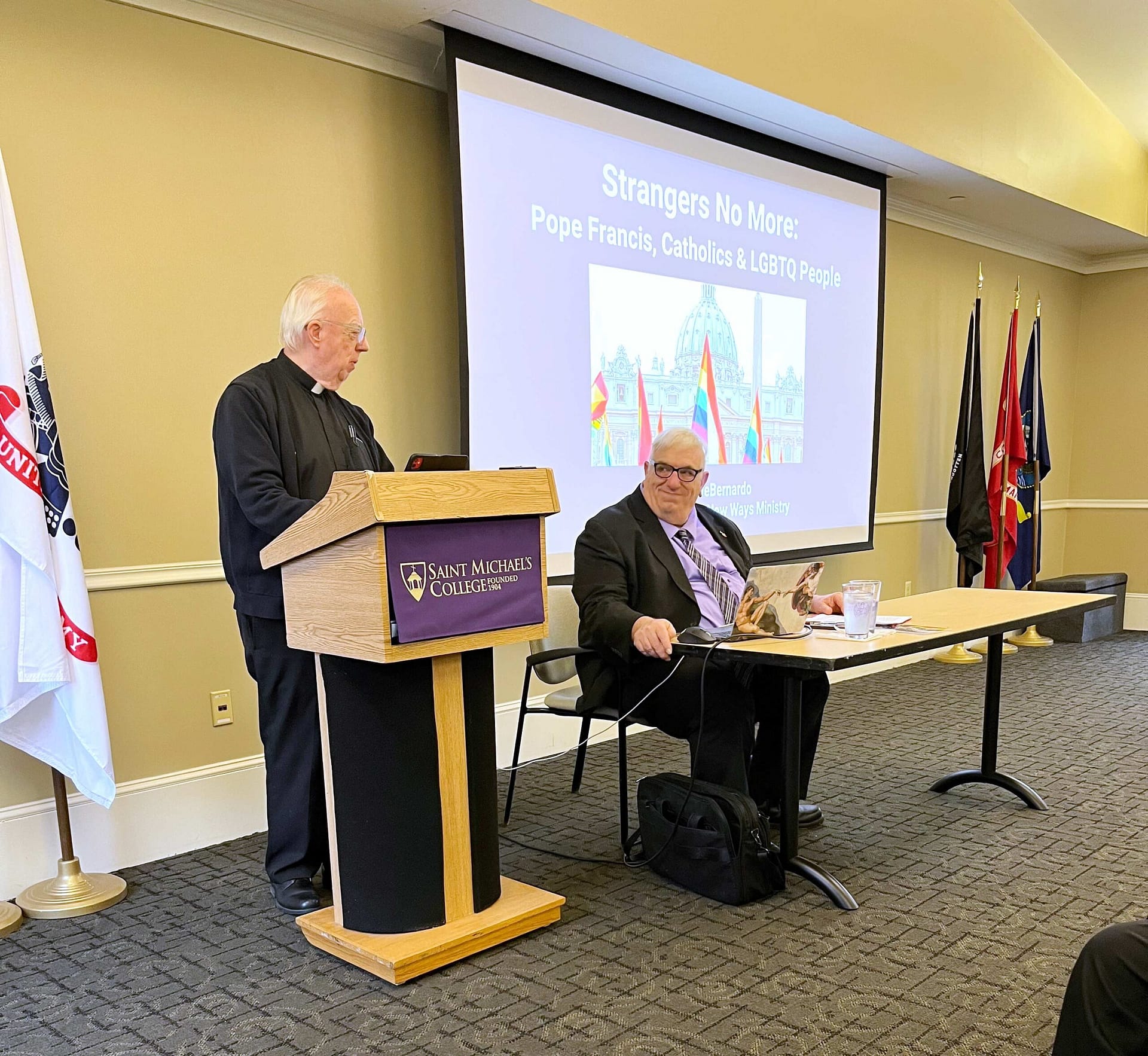 Fr. David Theroux, S.S.E., Director of the Edmundite Center for Peace and Justice, left, introduces Frank DeBernardo of New Ways Ministry during an event on April 10, 2024. (Photo by Elizabeth Murray/Saint Michael's College)