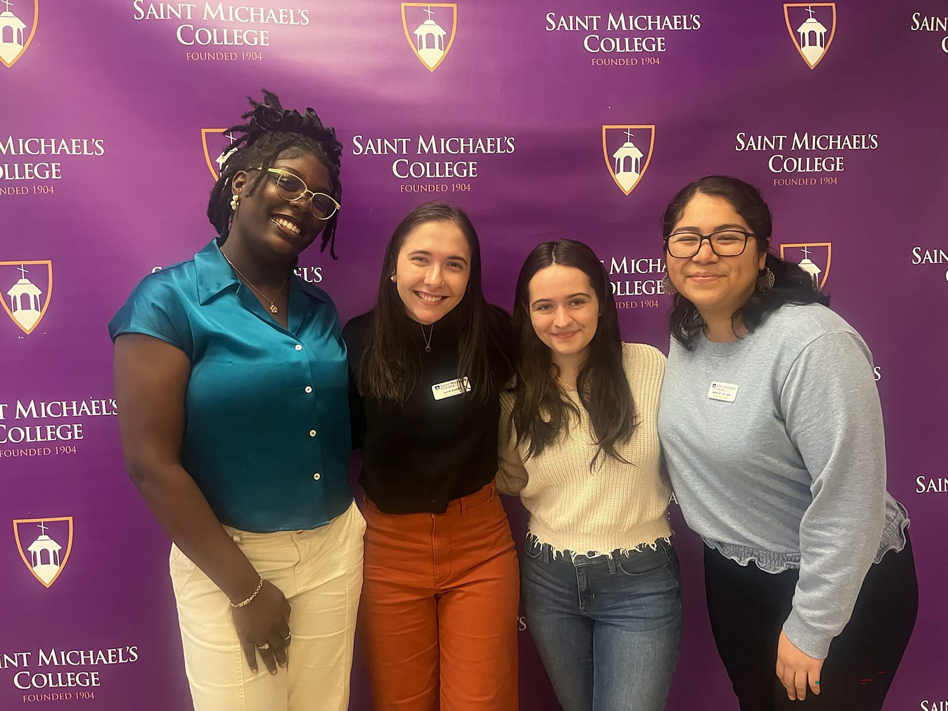 Members of the Office of Purposeful Learning pose with Saint Michael's students. 