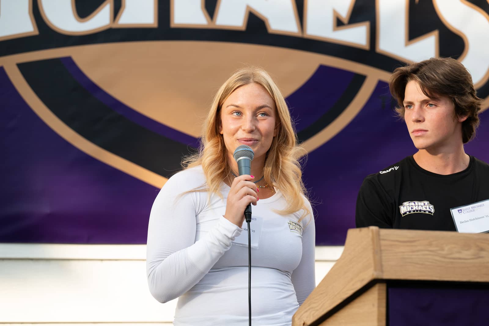 Maggie Frøland ’25 and Declan Hutchinson ’25, captains of the Alpine and Nordic Skiing Teams respectively, speak at the grand opening of the Kelley Ski Center on Sept. 20, 2024. 