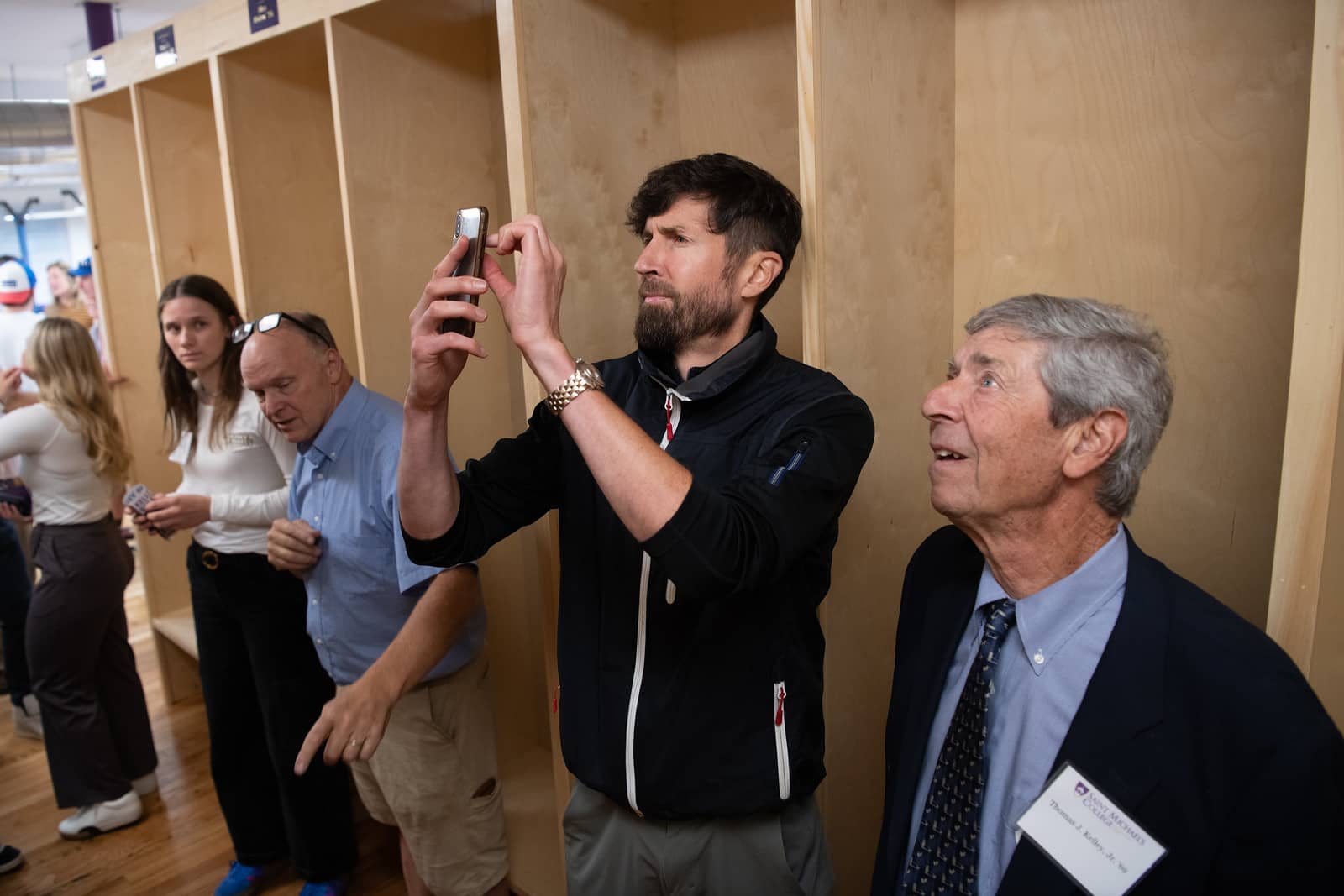 Tom Kelley ’69, right, takes in the interior of the new Kelley Ski Center as his son takes a photo following the grand opening and ribbon cutting on Sept. 20, 2024. (